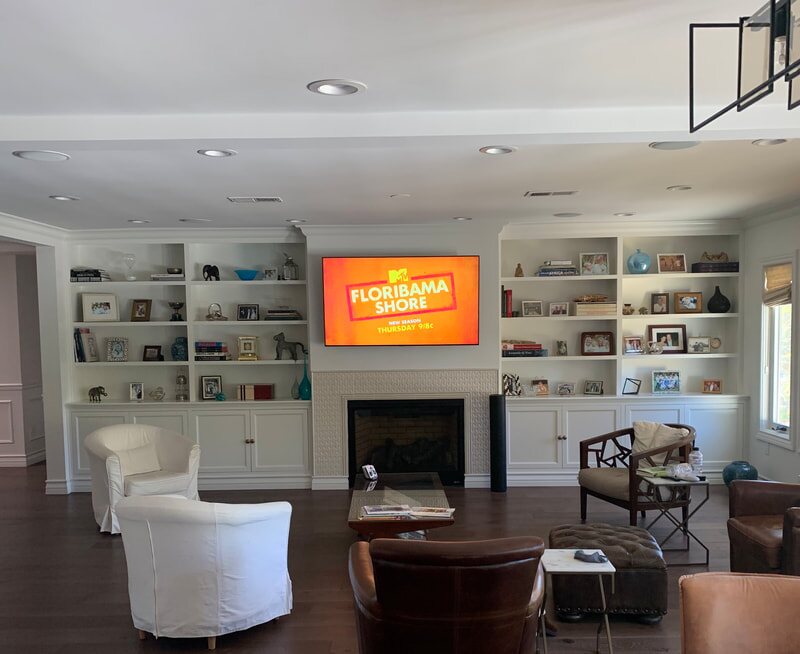 Built-in shelving flanking a fireplace