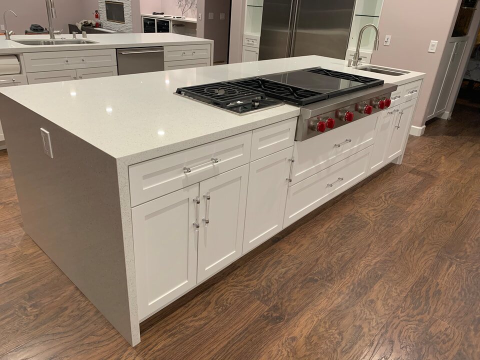 White island cabinetry with integrated professional range