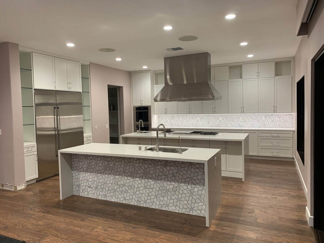 Modern white custom kitchen with two islands