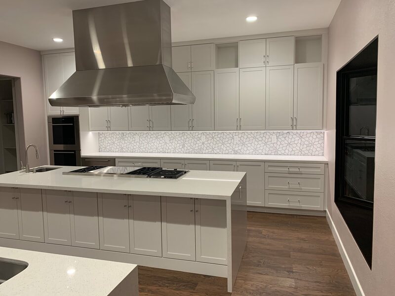 White kitchen with oversized custom island