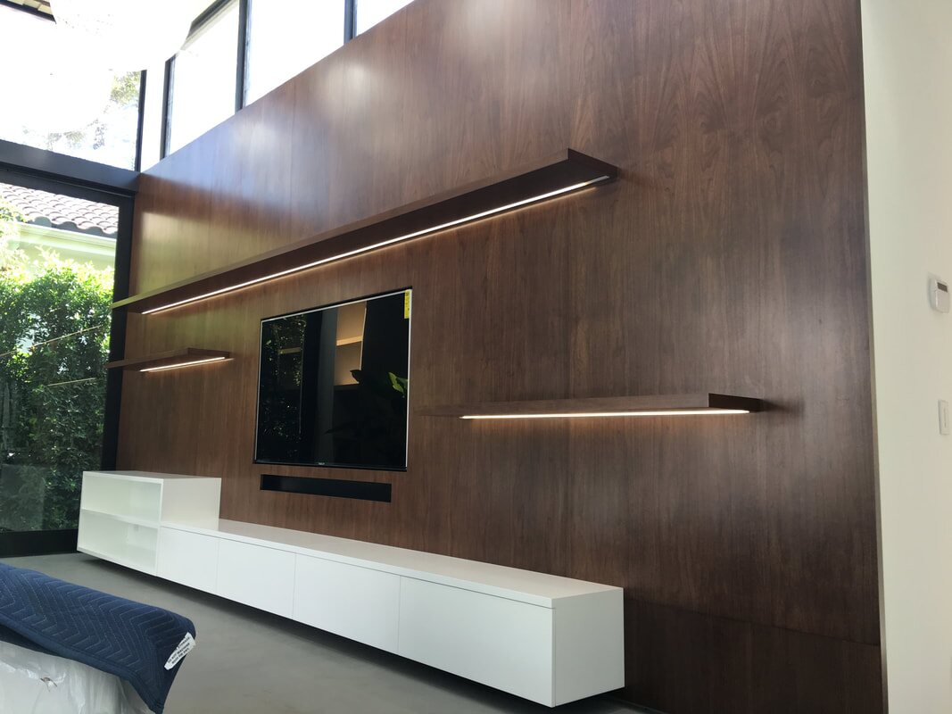 Walnut media wall with integrated lighting
