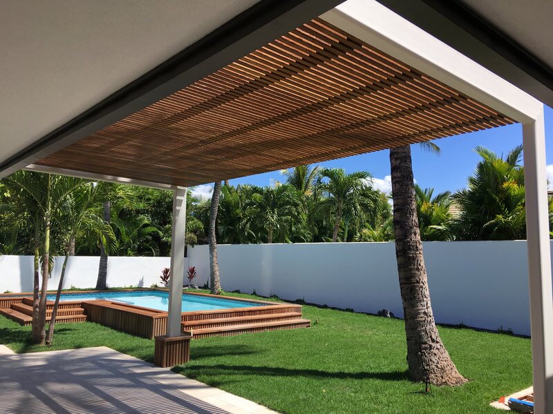 Poolside pergola with wood slat ceiling
